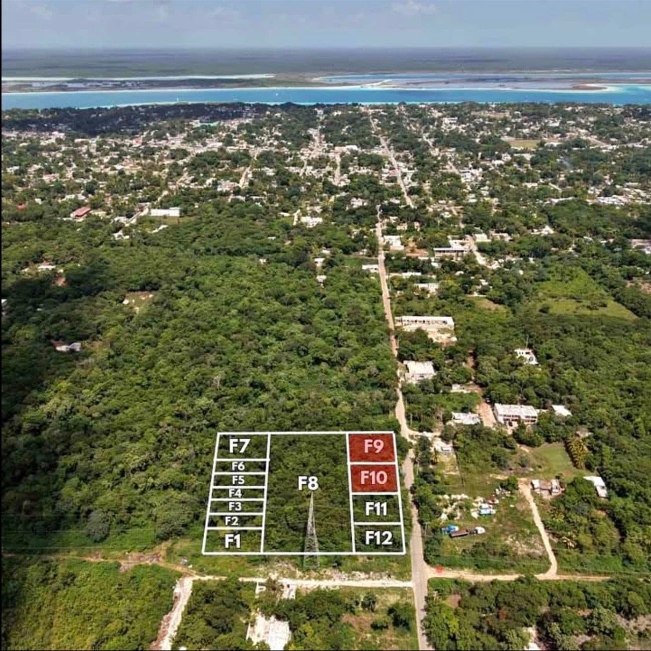 Aerial perspective of the C22 lot subdivision with Bacalar town and the lagoon in the background