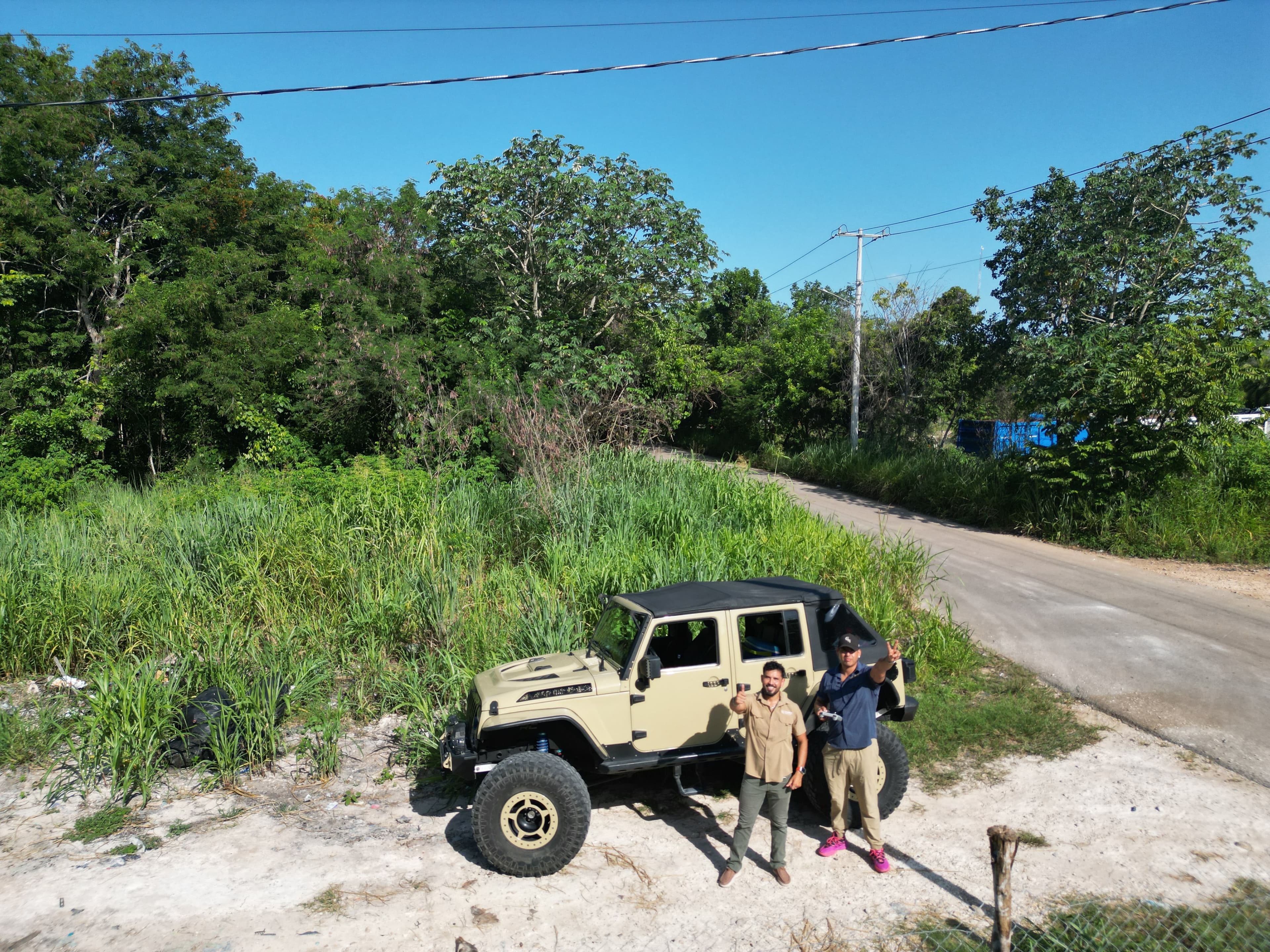 Terra Meridian team members beside the access road at the C22 lot in Bacalar